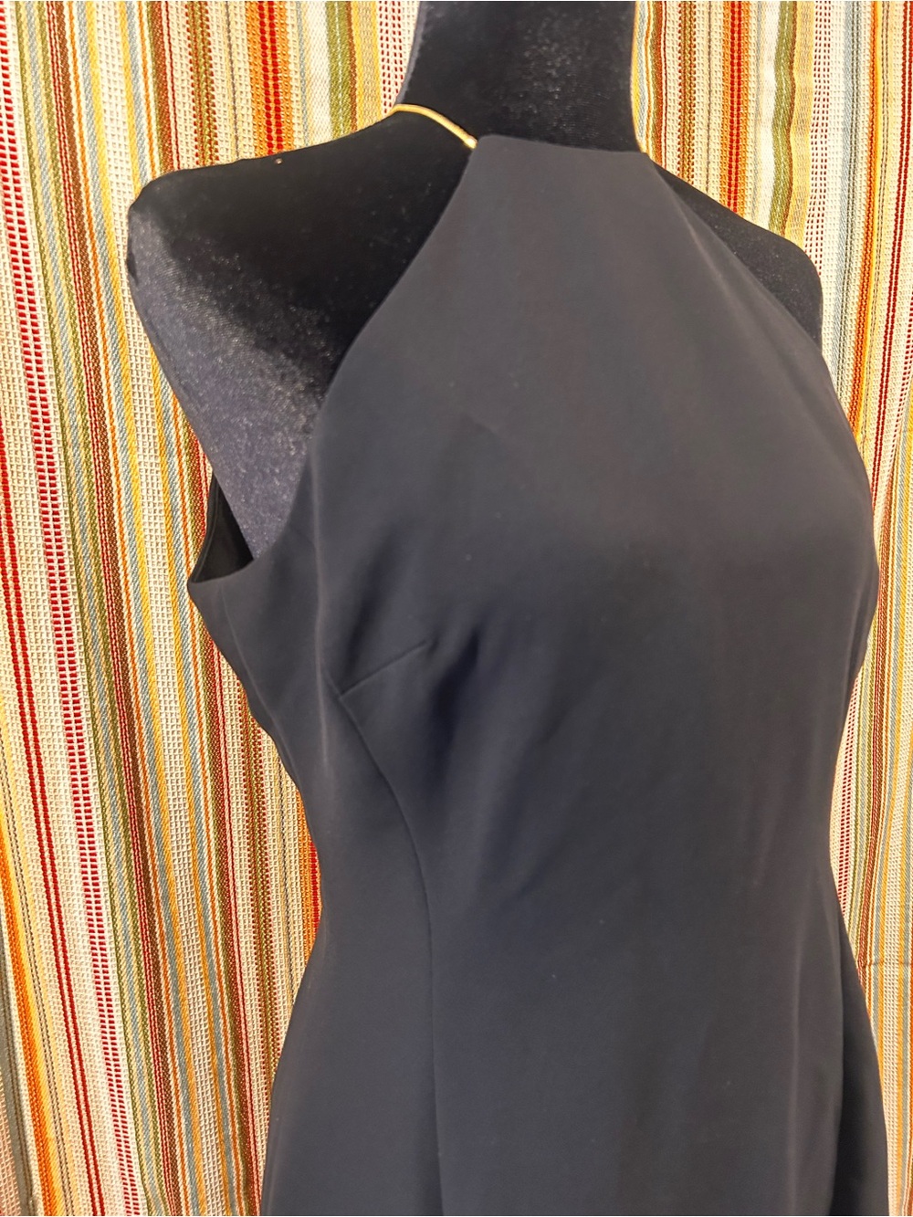 Vintage Jones, New York, black dress with gold chain highlights.
